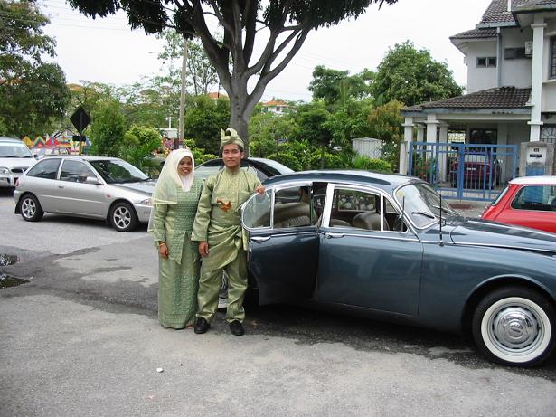 The Couple Posing In Front Of The "Limo"